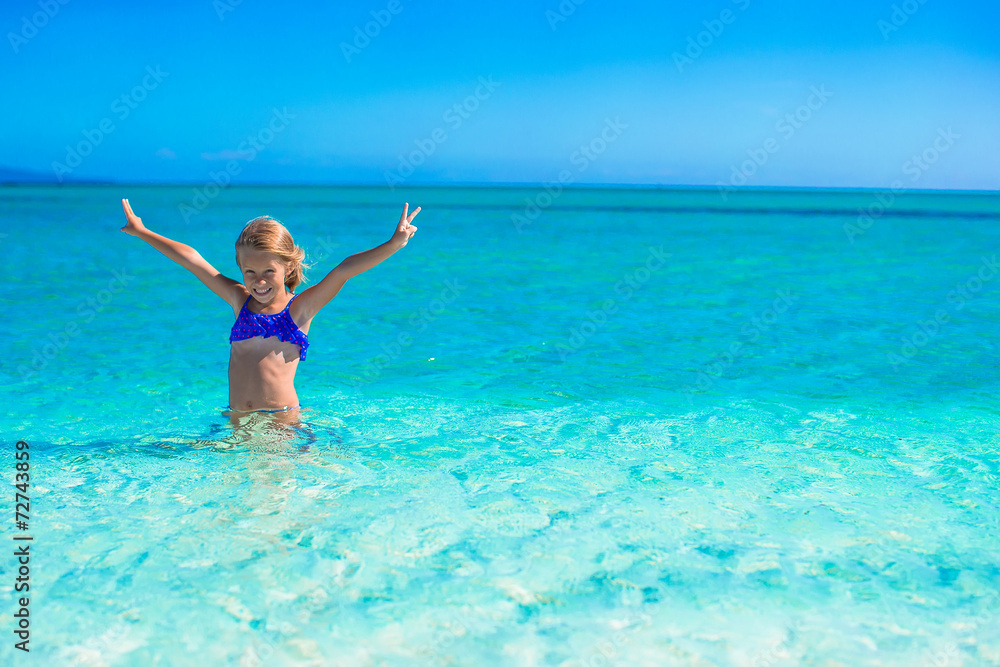 Little happy girl enjoying beach vacation Little happy girl enjoying beach vacation
