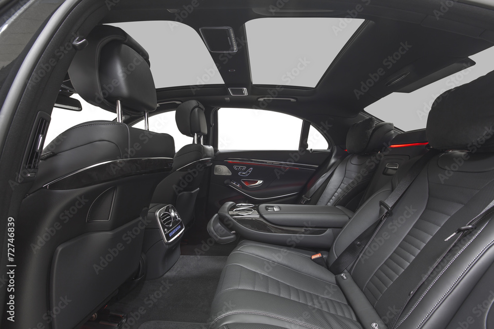 Interior of car. Black leather seats with red ambient light