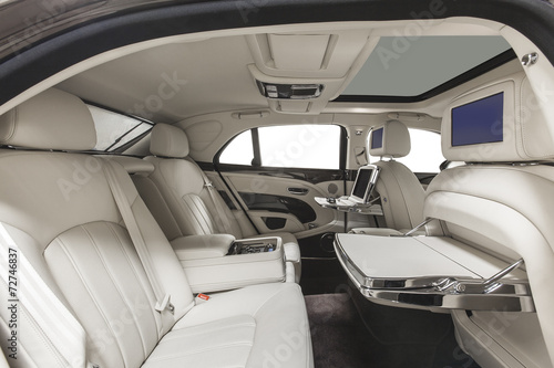 Interior of exclusive car. White leather seats