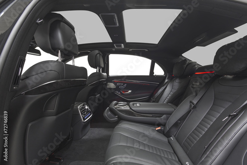 Interior of car. Black leather seats with red ambient light © dmindphoto