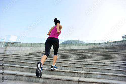 Runner athlete running on escalator stairs. 