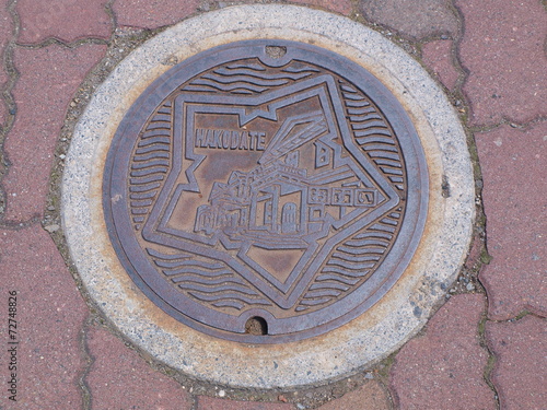 Manhole drain cover on the street at Hakodate, Hokkaido - Japan photo