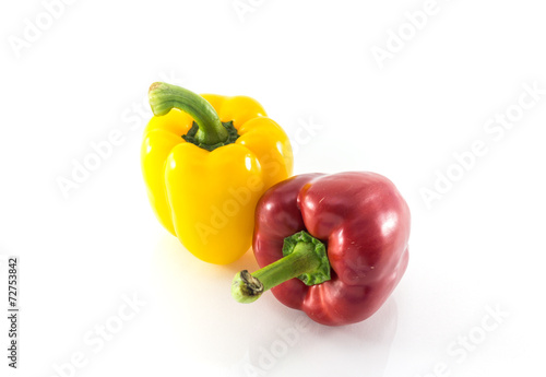 Red and yellow peppers solated on white