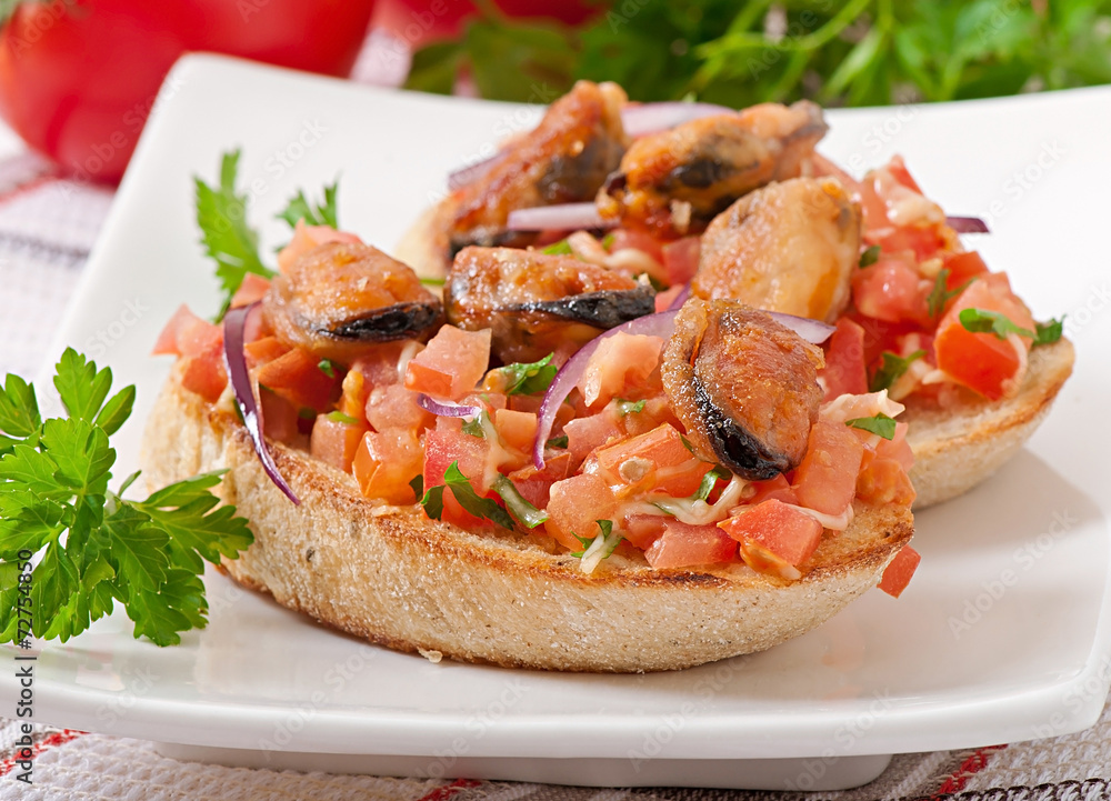 Bruschetta with mussels, cheese and tomatoes Bruschetta with mussels, cheese and tomatoes