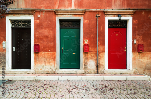 Three doors and three mailboxes of residential building