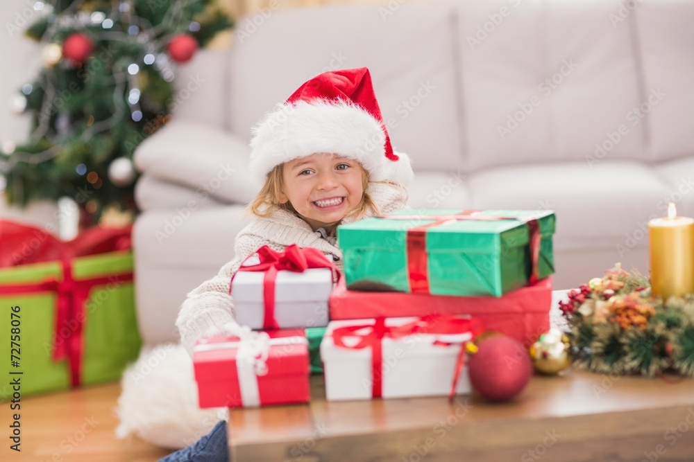 Cute little girl surrounded by christmas gifts Cute little girl surrounded by christmas gifts