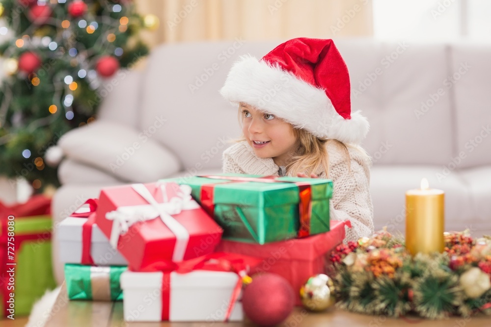 Cute little girl surrounded by christmas gifts Cute little girl surrounded by christmas gifts