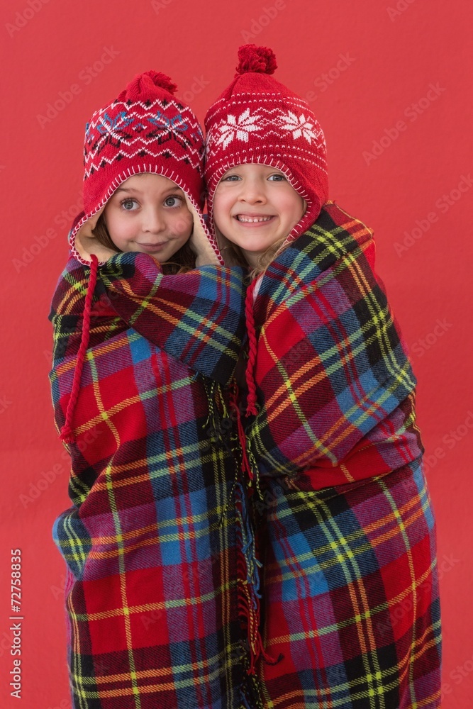 Festive little girls under a blanket Festive little girls under a blanket
