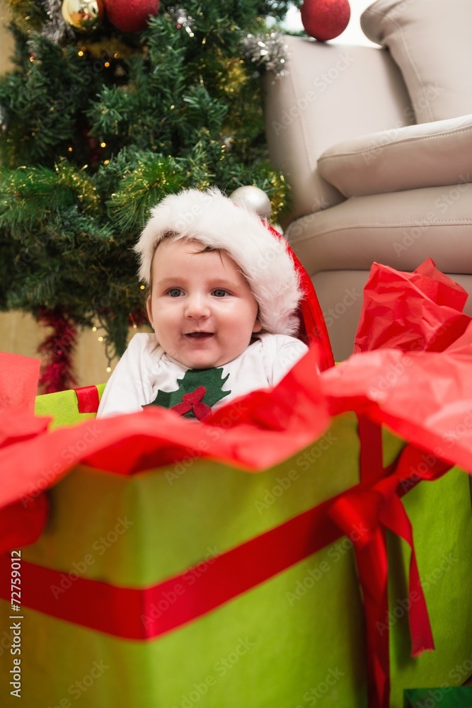 Cute baby boy in large christmas present Cute baby boy in large christmas present