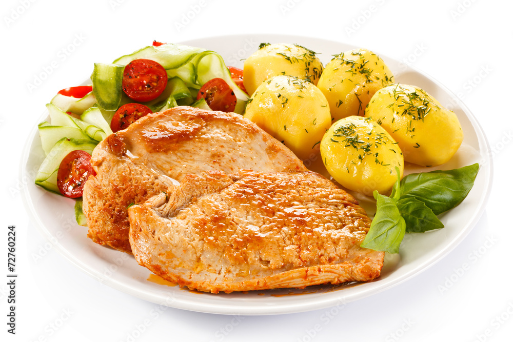 Fried pork chops, boiled potatoes and vegetable salad Fried pork chops, boiled potatoes and vegetable salad
