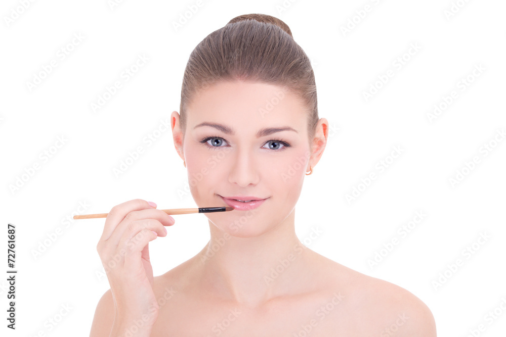 portrait of young beautiful woman applying lipstick on her lips portrait of young beautiful woman applying lipstick on her lips
