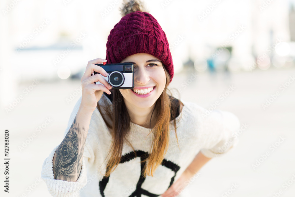 Woman using vintage camera
