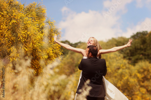 Bride and Groom having fun in the fields