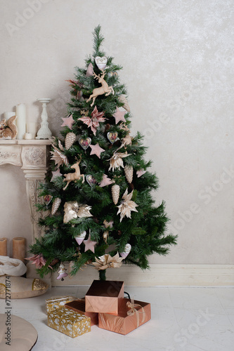Christmas tree with gifts in the interior