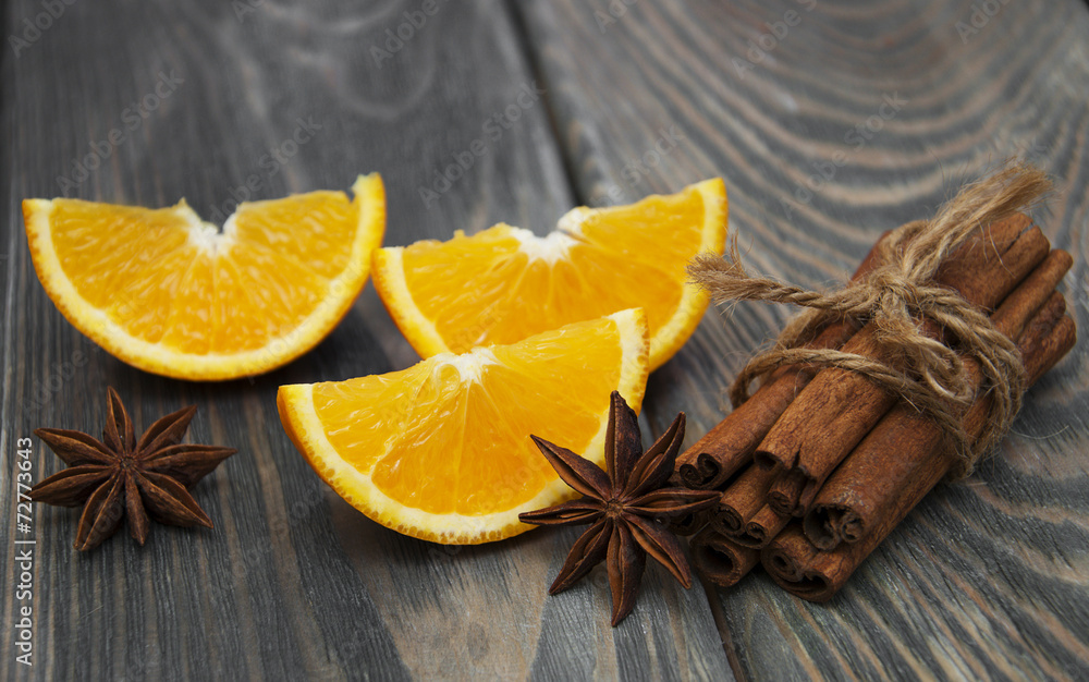 Orange with cinnamon sticks Orange with cinnamon sticks