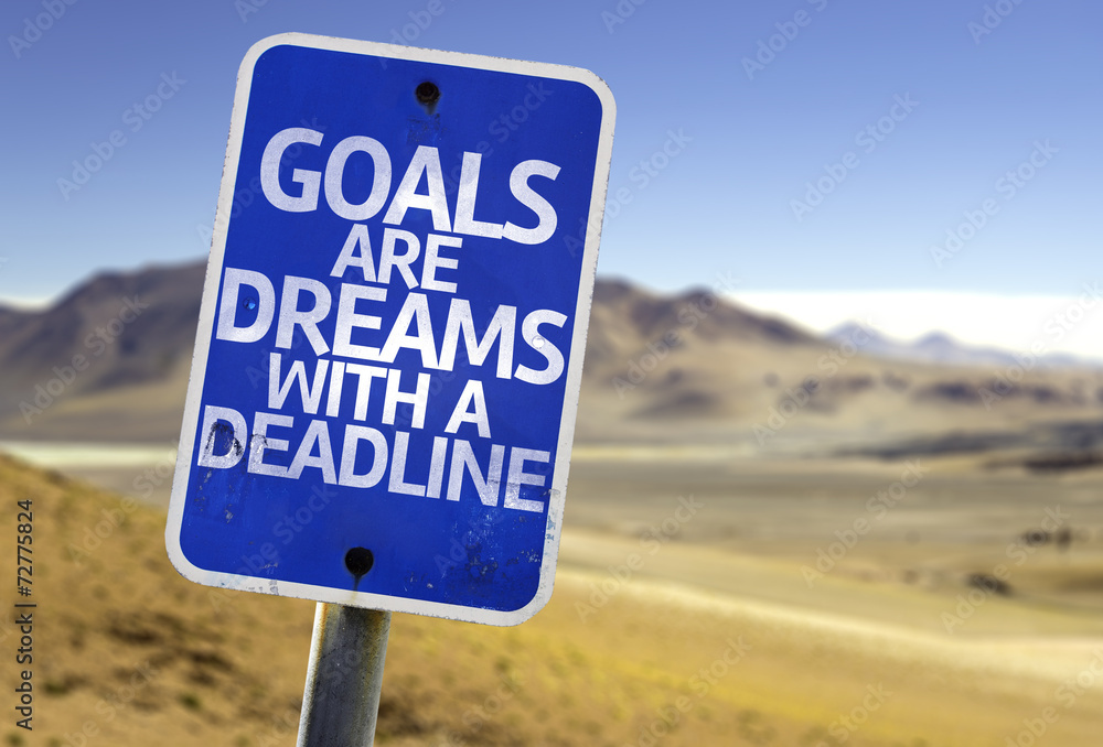 Goals Are Dreams With a Deadline sign with a desert Goals Are Dreams With a Deadline sign with a desert