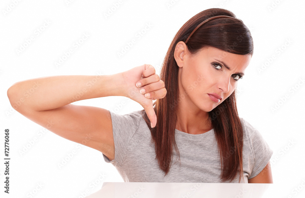 Unhappy girl with bad job gesture Unhappy girl with bad job gesture