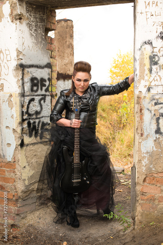 Fototapeta Naklejka Na Ścianę i Meble -  Rock woman with guitar