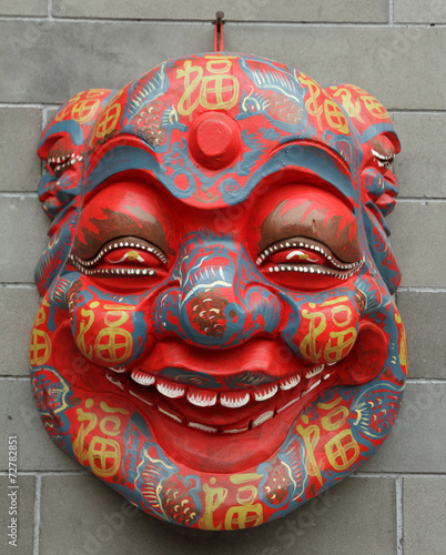 chinese mask on wall on Liulichang street in Beijing
