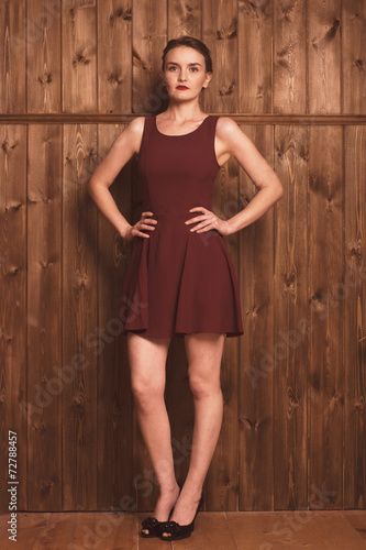 beautiful girl in a burgundy dress