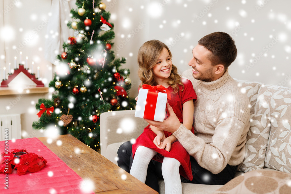 smiling father and daughter holding gift box smiling father and daughter holding gift box