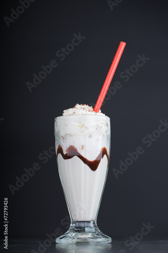 vanilla milkshake on black background
