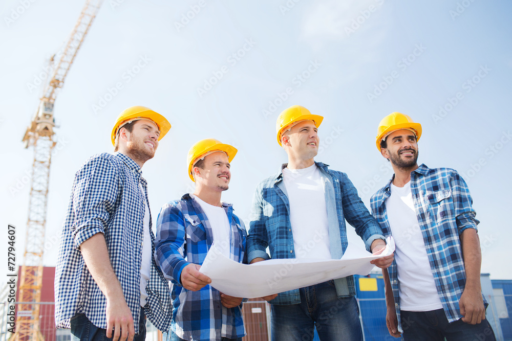 group of builders with tablet pc and blueprint group of builders with tablet pc and blueprint