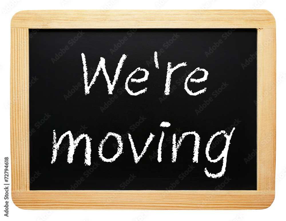 We are moving - Blackboard on white background We are moving - Blackboard on white background