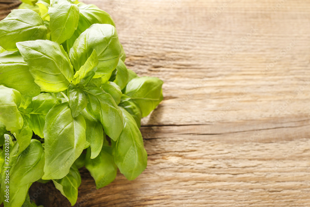 Basil leaves on wooden background. Basil leaves on wooden background.