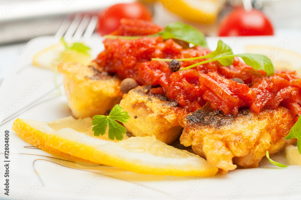 Fried fish with vegetable sauce. Fried fish with vegetable sauce.