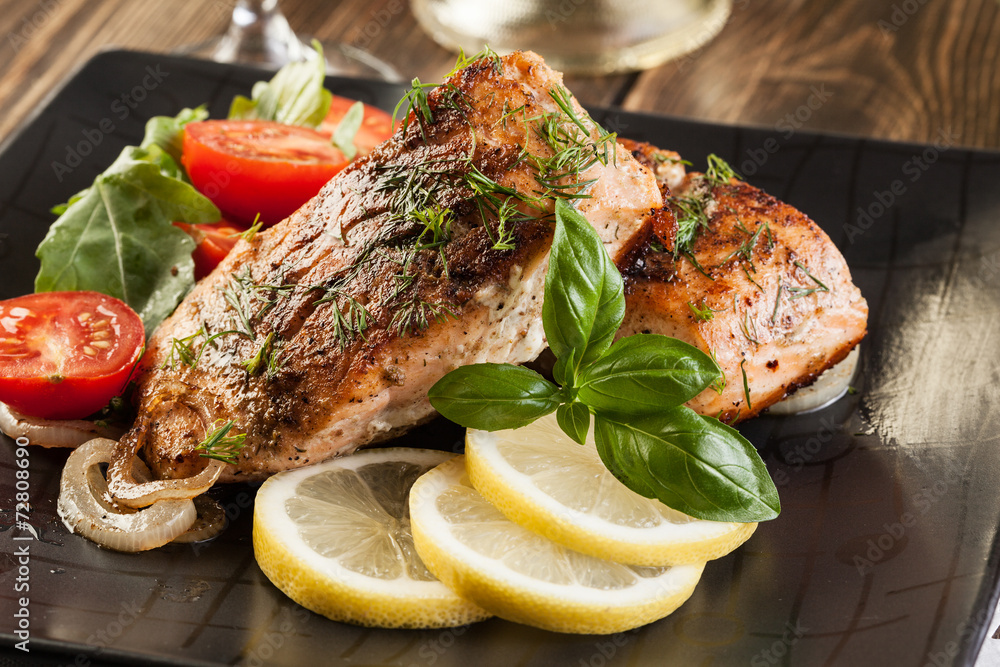 Fried salmon steak with vegetables Fried salmon steak with vegetables