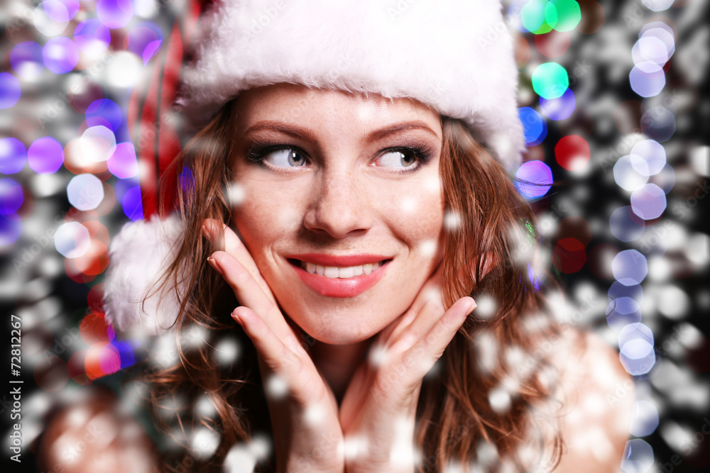 Portrait of beautiful young woman on bright lights background Portrait of beautiful young woman on bright lights background