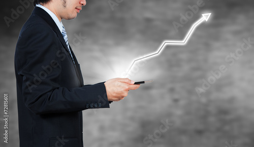 Businessman using tablet with digital visual object, business st