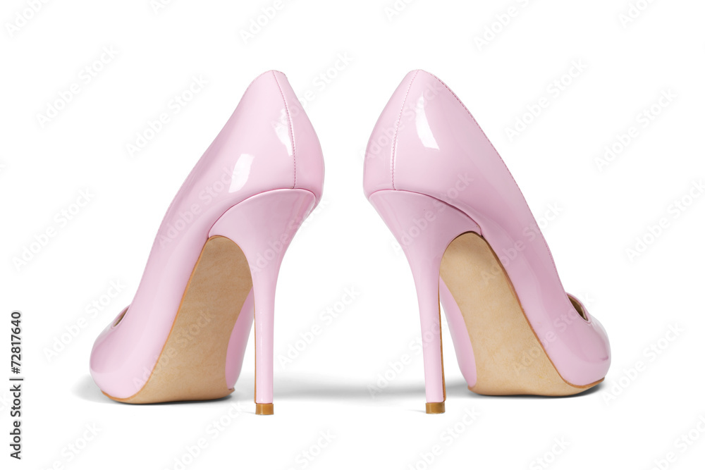 A pair of pink women's heel shoes isolated with clipping path. A pair of pink women's heel shoes isolated with clipping path.