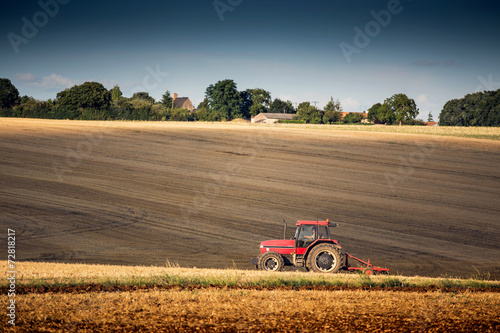 Tractor harrowing a field west of Poitiers in south western Fran