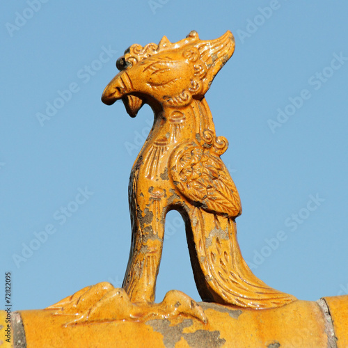 Phoenix figurine on roof of imperial chinese building