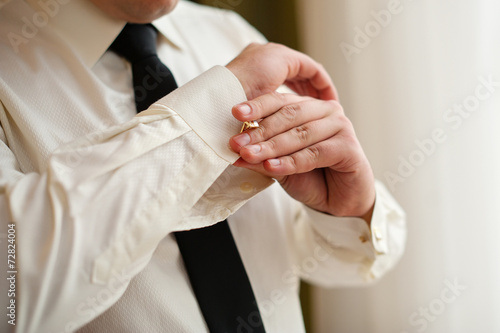 men wear cufflinks on a shirt sleeve