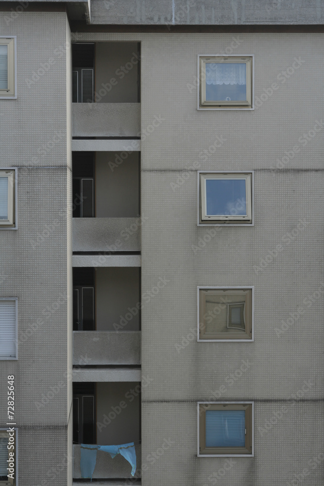 windows of an apartment block in trieste, italy