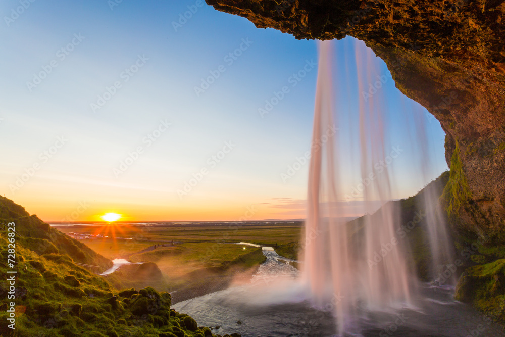 Seljalandsfoss, waterfall in Iceland, sunset and sunstar
