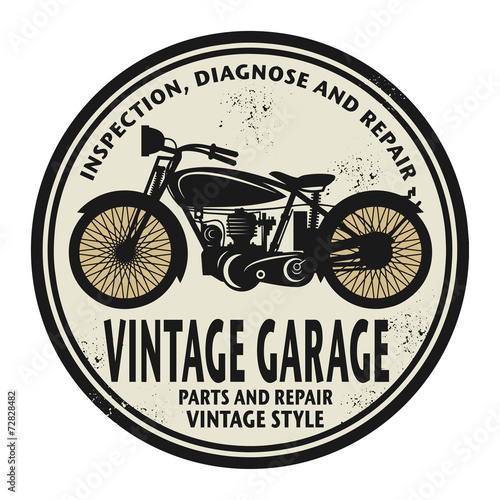 Grunge rubber stamp with the words Vintage Garage