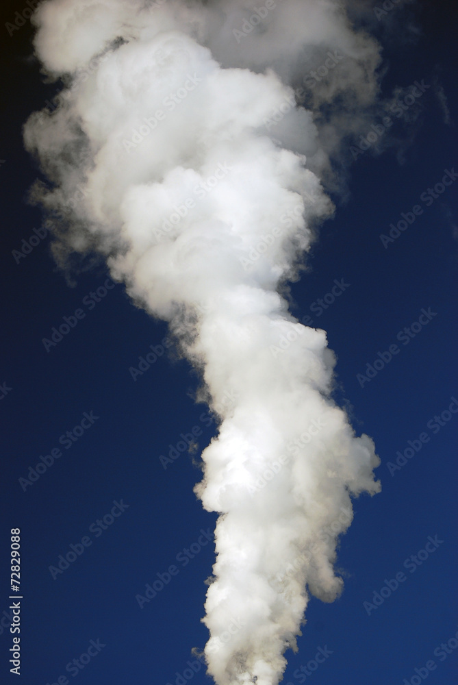 A stream of white smog in blue sky. A stream of white smog in blue sky.