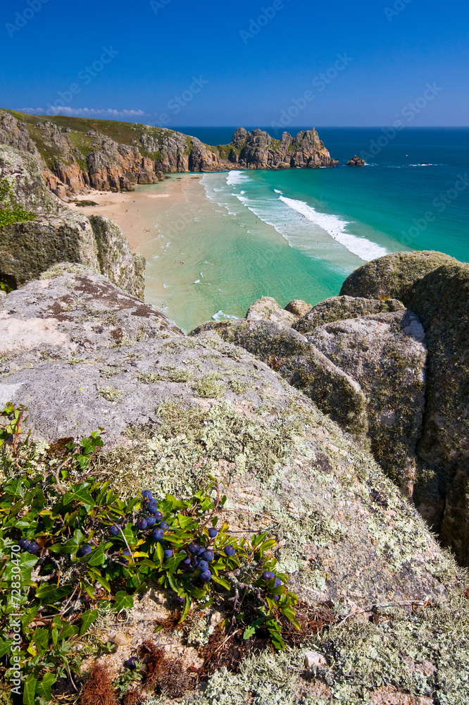 Sea cliffs over beach in Porthcurno, Cornwall, UK.