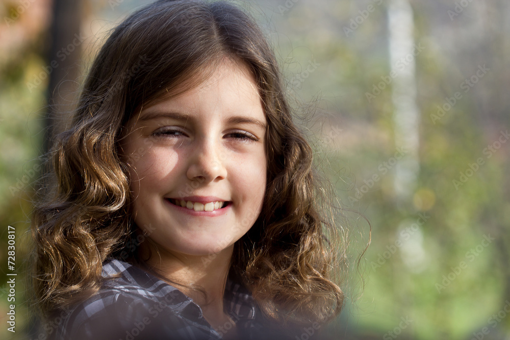 Pretty haired little girl outdoor portrait Pretty haired little girl outdoor portrait
