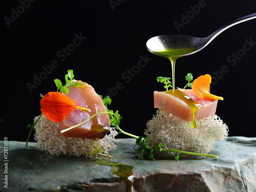 Fine dining, fresh raw ahi tuna sashimi served on sponge