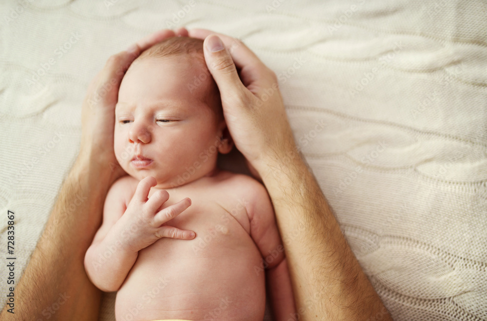 Cute newborn baby girl at home