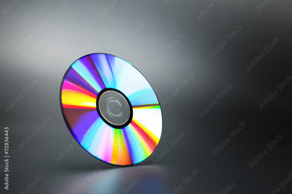 Compact disk on grey Compact disk on grey