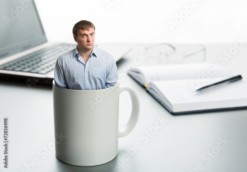 Slika na platnu Astonished man in cup