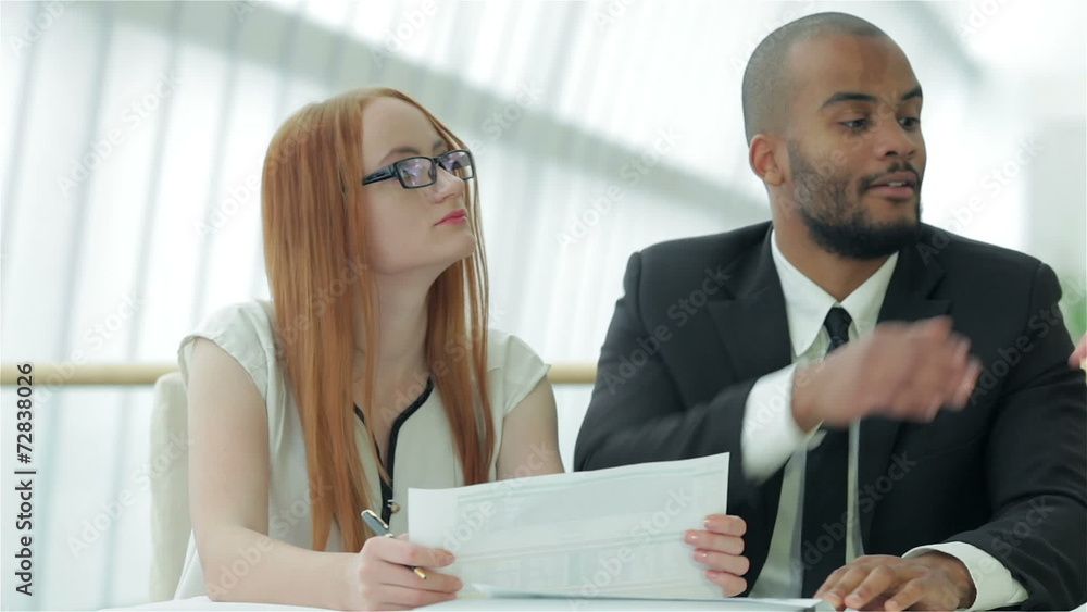 Two businessman discussing documents Two businessman discussing documents