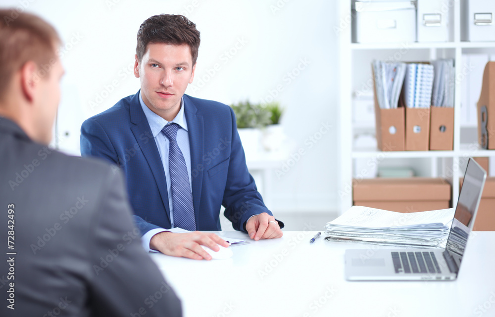 Business people working with laptop in an office Business people working with laptop in an office