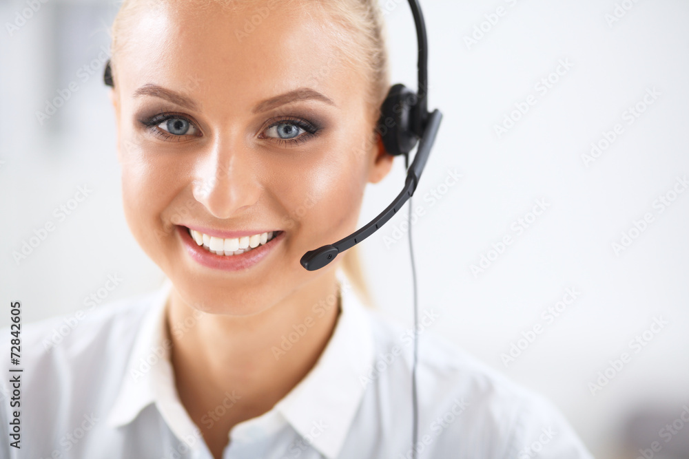Close-up portrait of a customer service agent sitting at office Close-up portrait of a customer service agent sitting at office